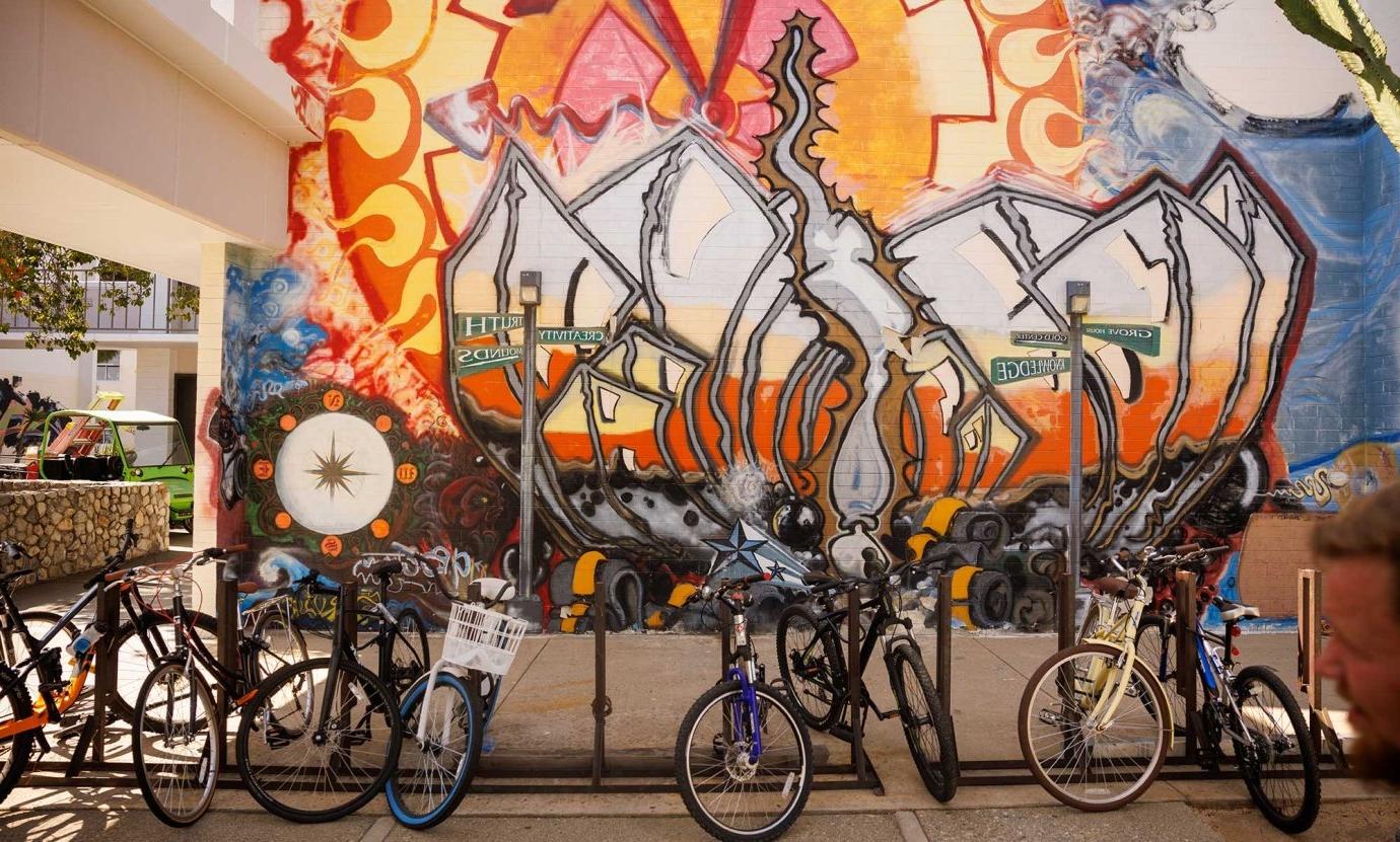 a colorful mural was painted behind the bikestands on Mead Hall