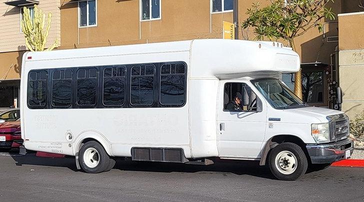 a white sagehen shuttle sits parked in mesa parking lot